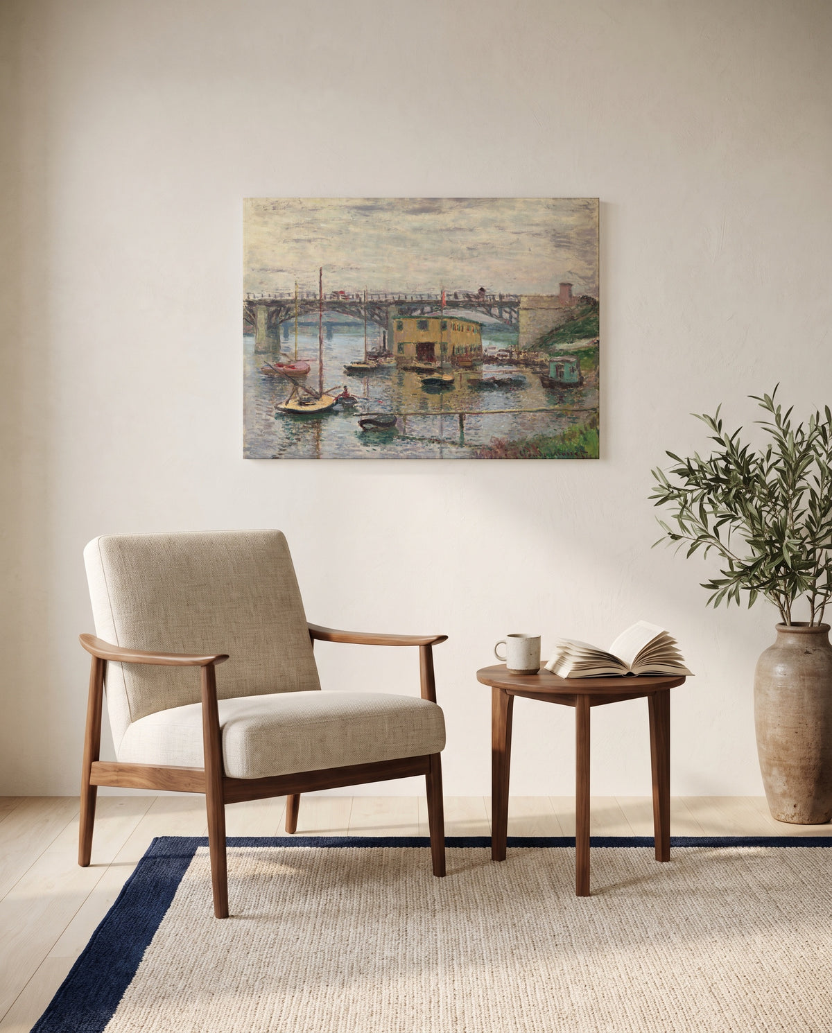 Argenteuil on a Gray Day by Claude Monet as a stretched canvas above a linen lounge chair in a reading corner