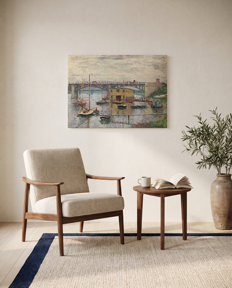Argenteuil on a Gray Day by Claude Monet as a stretched canvas above a linen lounge chair in a reading corner