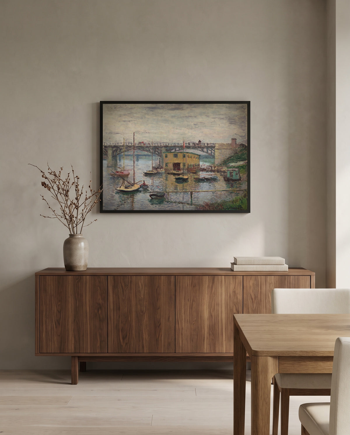 Argenteuil on a Gray Day by Claude Monet in a black frame above a walnut sideboard in a dining room