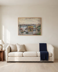Argenteuil on a Gray Day by Claude Monet framed in natural oak above a cream sofa in a warm living room