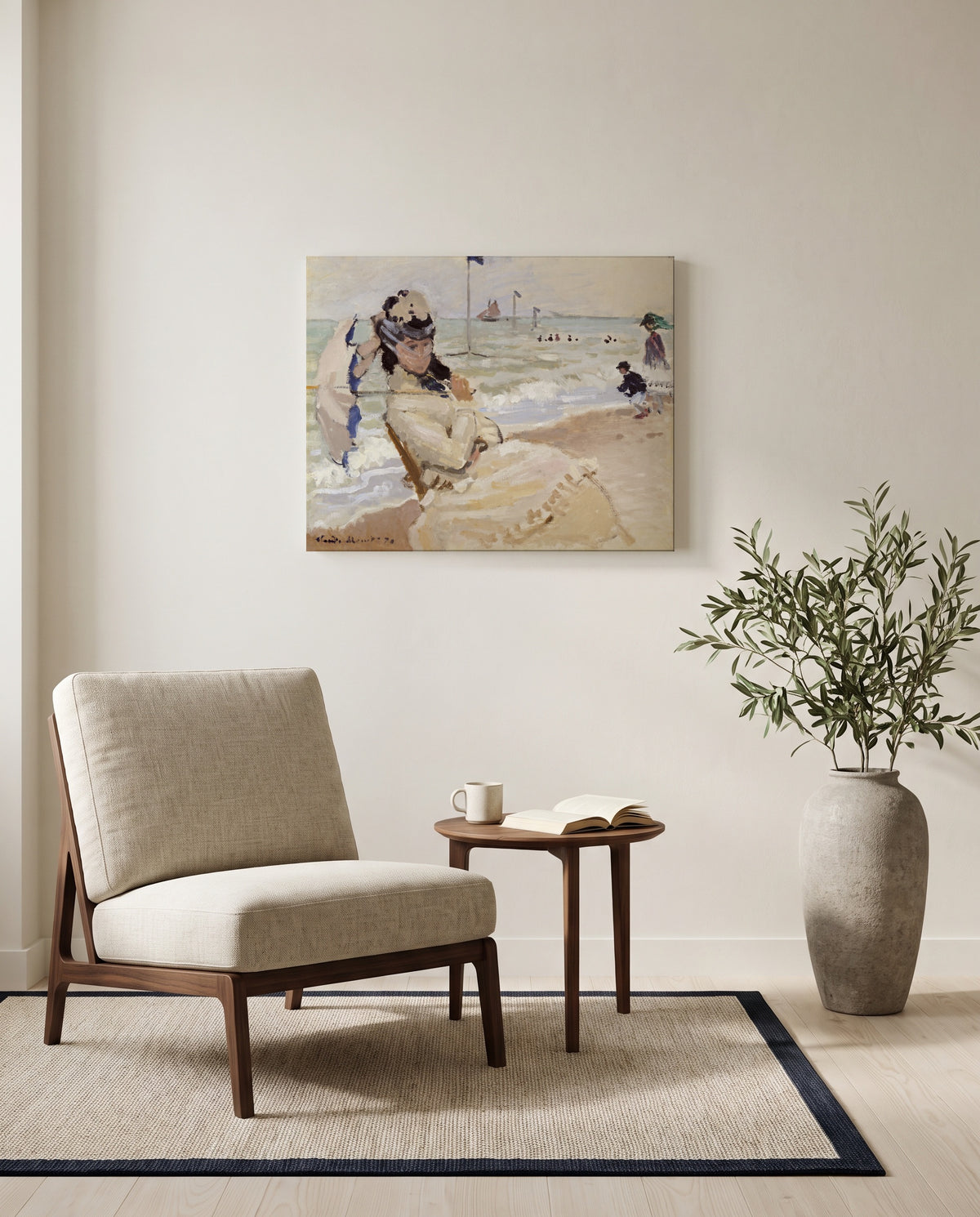 Camille on the Beach by Claude Monet as a stretched canvas above a linen lounge chair in a reading corner