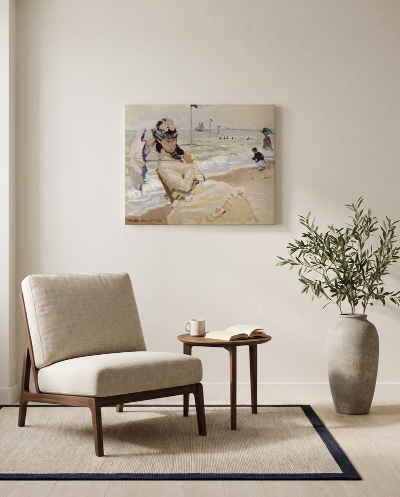 Camille on the Beach by Claude Monet as a stretched canvas above a linen lounge chair in a reading corner