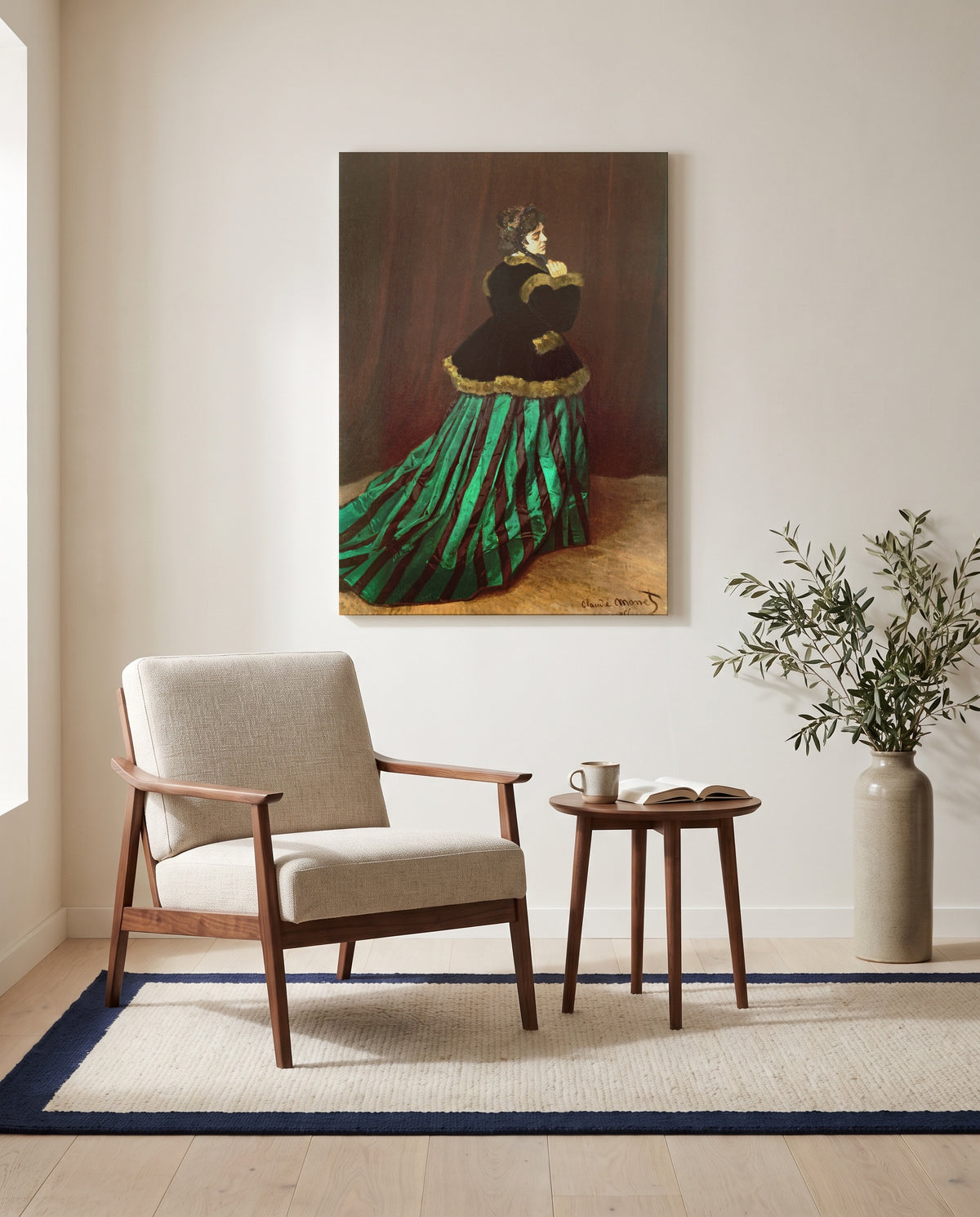 Camille by Claude Monet as a stretched canvas above a linen lounge chair in a reading corner