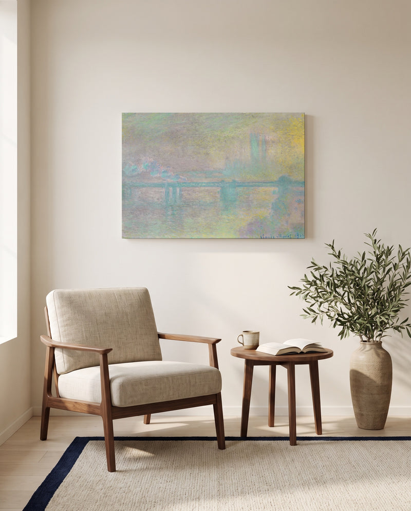 Charing Cross Bridge by Claude Monet as a stretched canvas above a linen lounge chair in a reading corner
