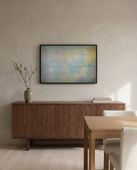 Charing Cross Bridge by Claude Monet in a black frame above a walnut sideboard in a dining room