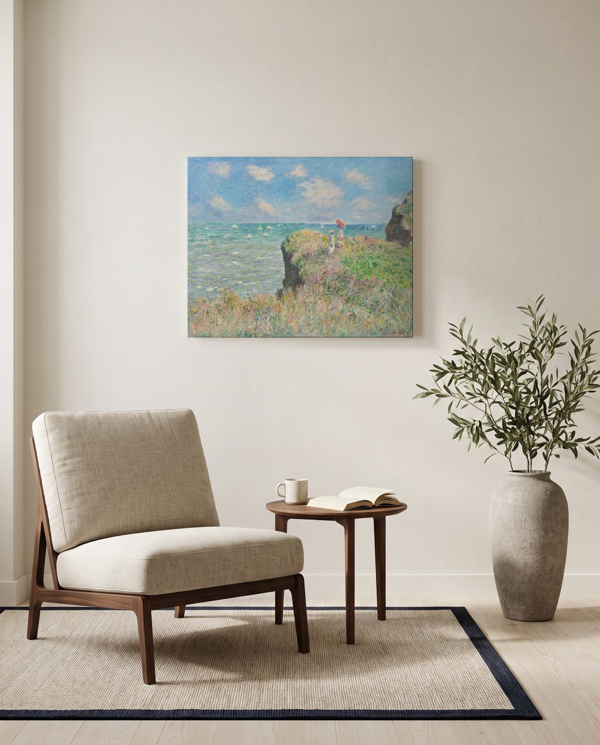 Cliff Walk at Pourville by Claude Monet as a stretched canvas above a linen lounge chair in a reading corner