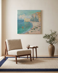 Étretat, Falaise d’Amont by Claude Monet as a stretched canvas above a linen lounge chair in a reading corner