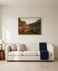 Farm Courtyard, Normandy by Claude Monet framed in natural oak above a cream sofa in a warm living room