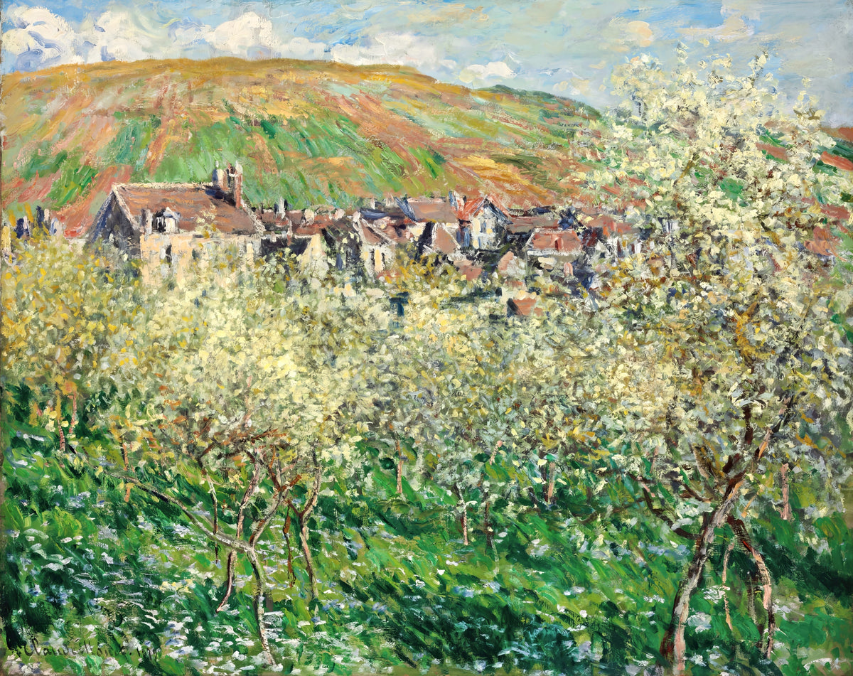 Plum Trees in Blossom by Claude Monet: a white flowering plum tree in long green grass, village roofs and a hill behind