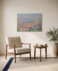 Gardener’s House at Antibes by Claude Monet as a stretched canvas above a linen lounge chair in a reading corner