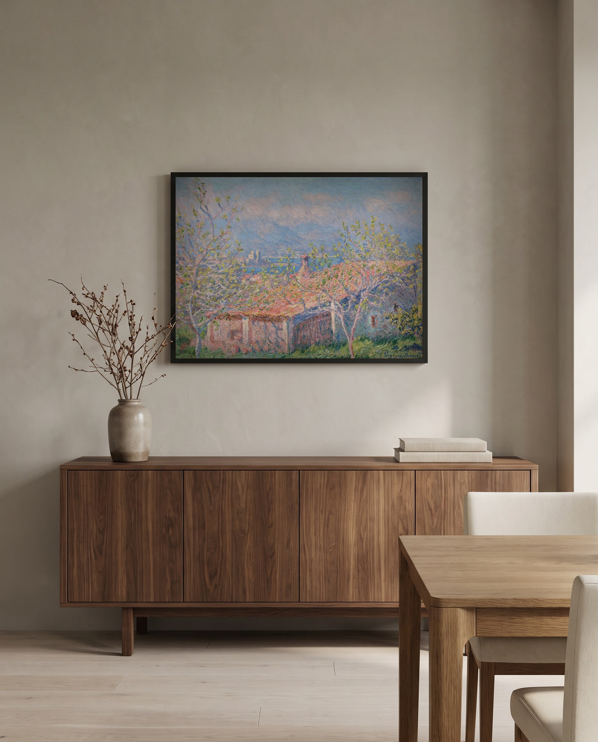 Gardener’s House at Antibes by Claude Monet in a black frame above a walnut sideboard in a dining room