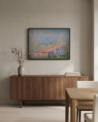 Gardener’s House at Antibes by Claude Monet in a black frame above a walnut sideboard in a dining room