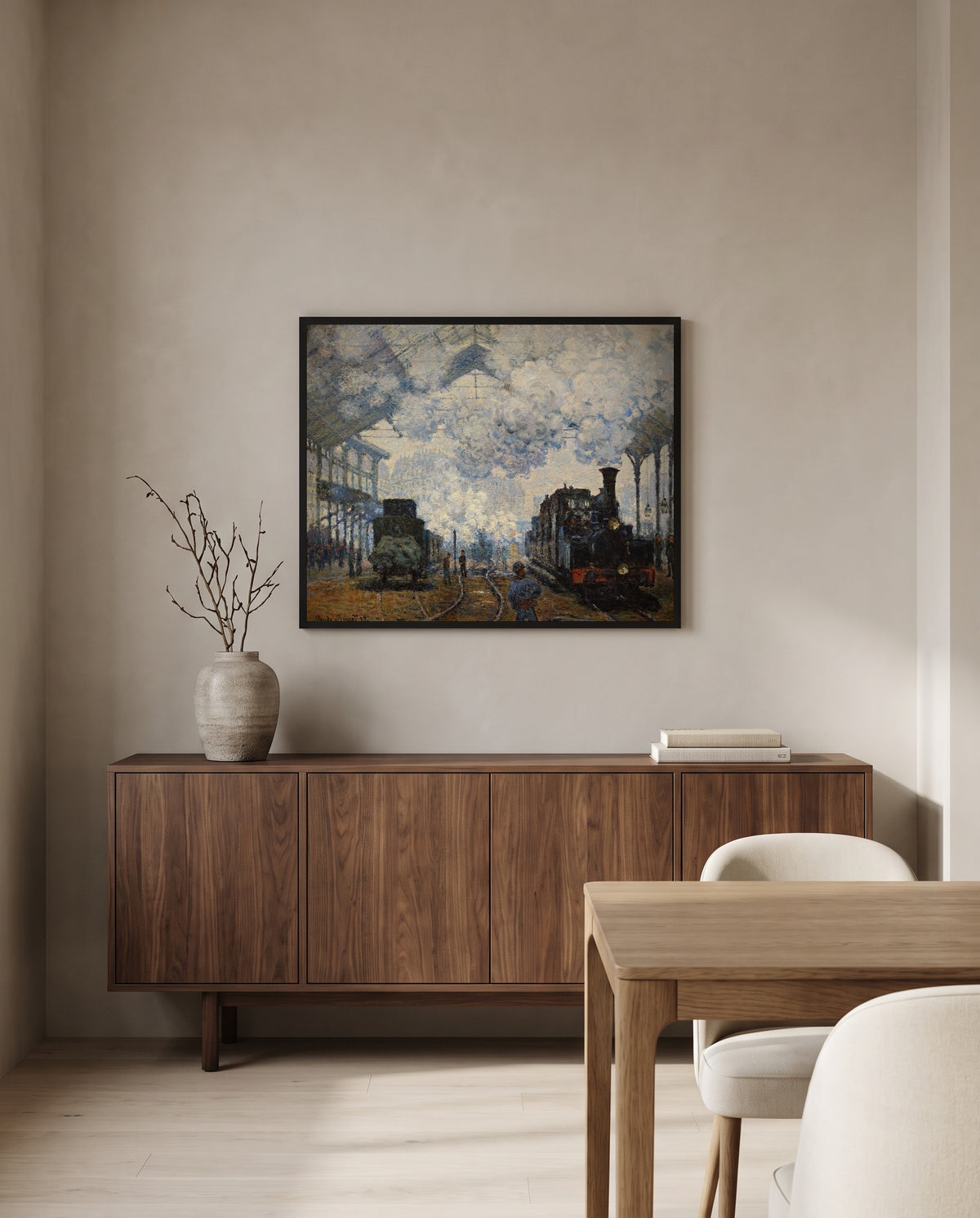 Gare Saint-Lazare by Claude Monet in a black frame above a walnut sideboard in a dining room