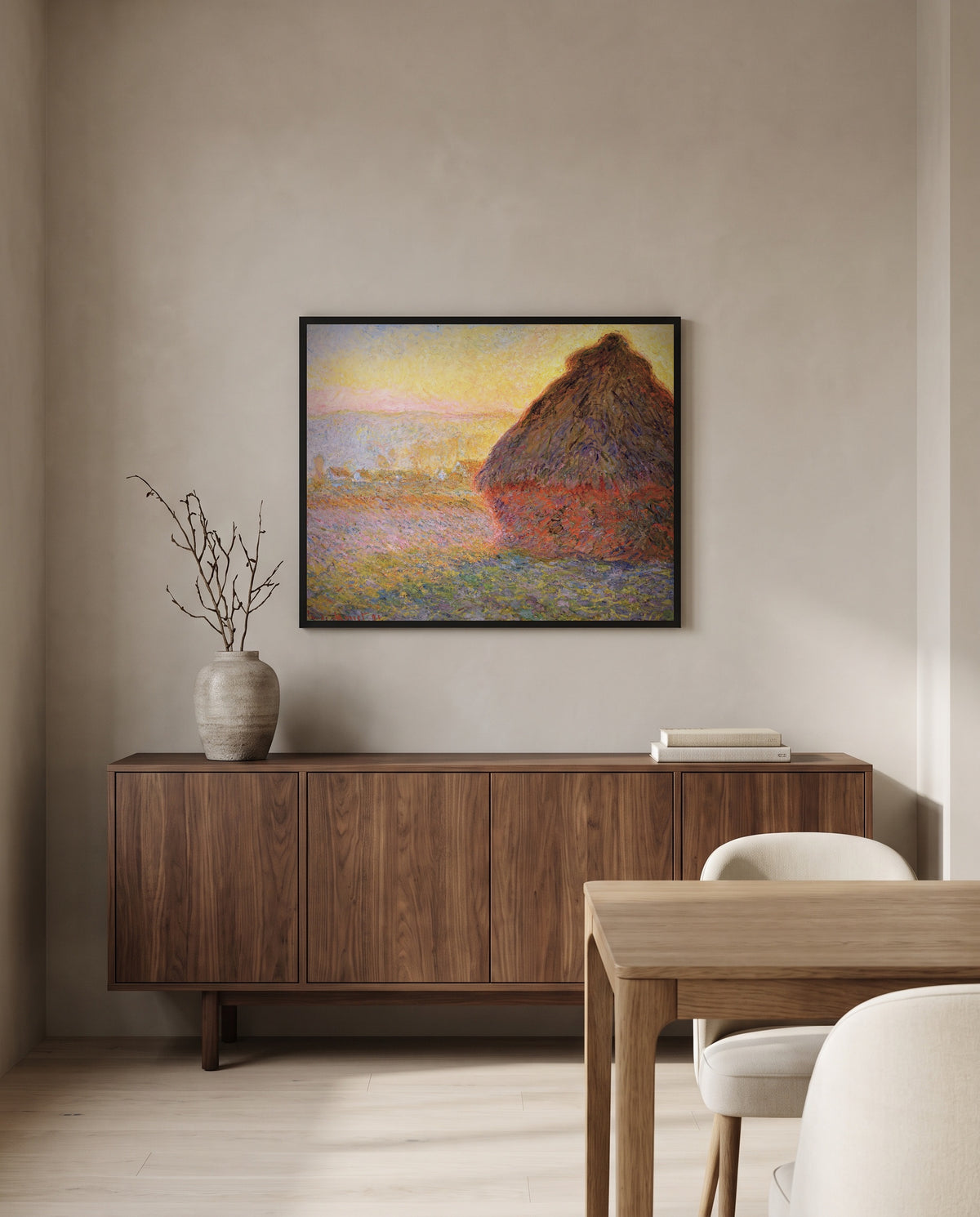 Grainstack (Sunset) by Claude Monet in a black frame above a walnut sideboard in a dining room