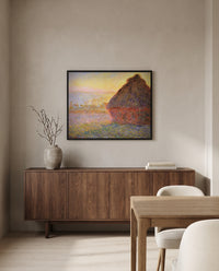 Grainstack (Sunset) by Claude Monet in a black frame above a walnut sideboard in a dining room