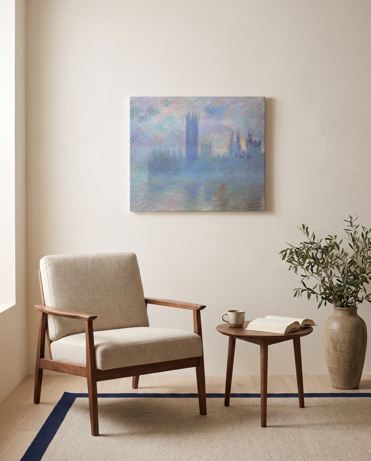 Houses of Parliament, London by Claude Monet as a stretched canvas above a linen lounge chair in a reading corner