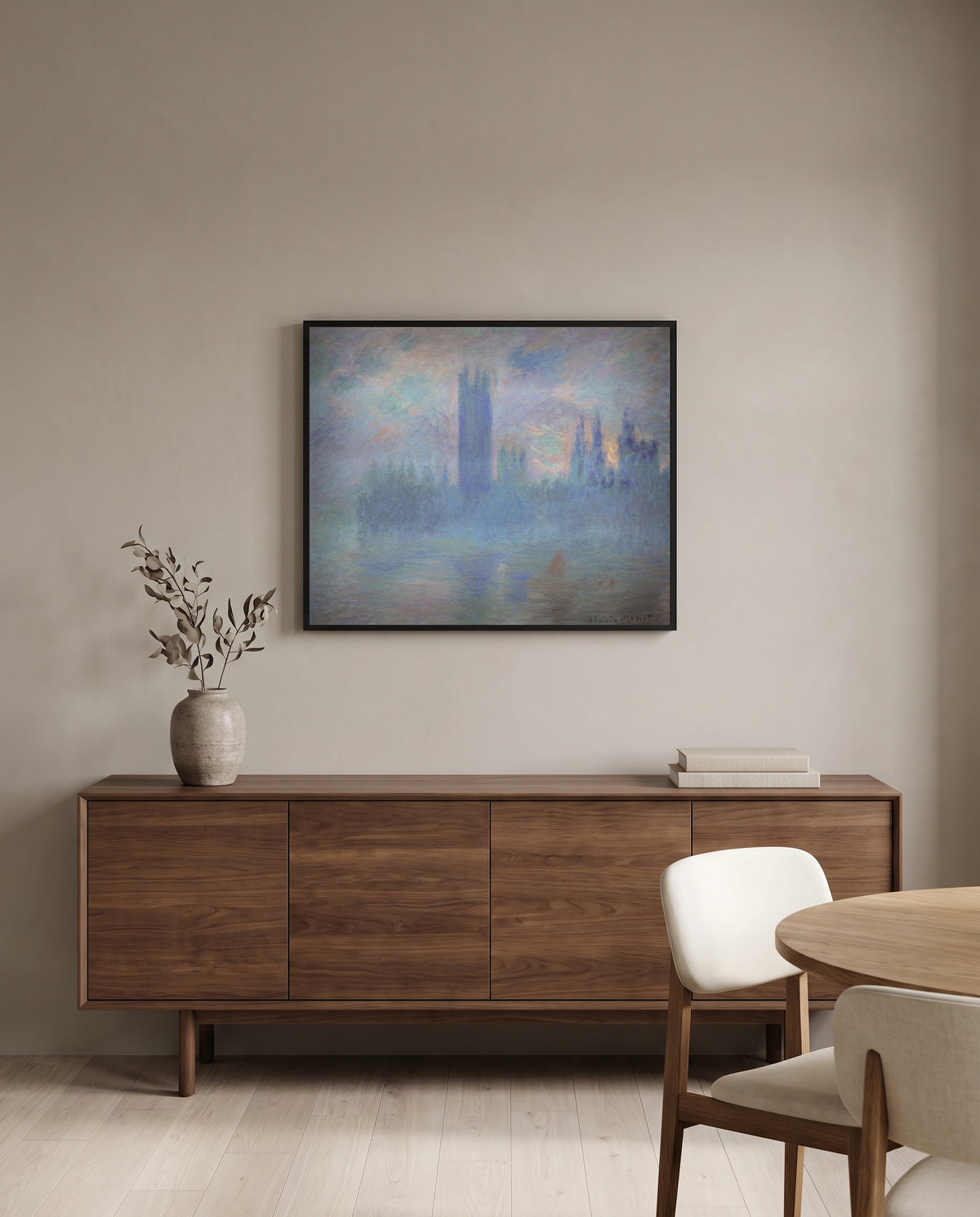 Houses of Parliament, London by Claude Monet in a black frame above a walnut sideboard in a dining room