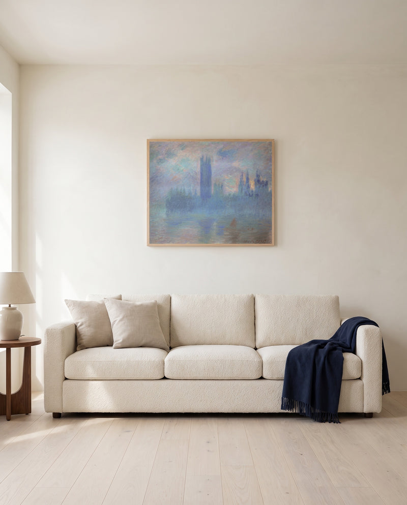 Houses of Parliament, London by Claude Monet framed in natural oak above a cream sofa in a warm living room