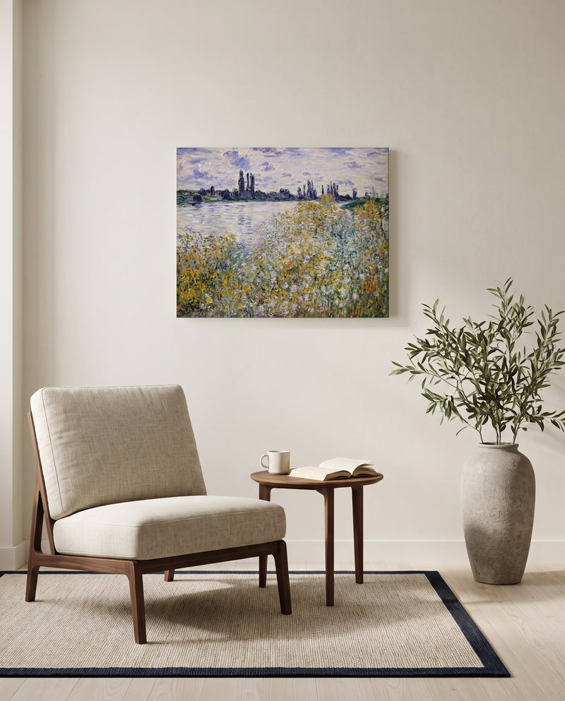 Île aux Fleurs, Vétheuil by Claude Monet as a stretched canvas above a linen lounge chair in a reading corner