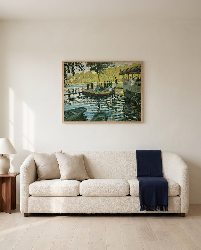 La Grenouillère by Claude Monet framed in natural oak above a cream sofa in a warm living room