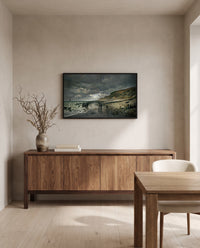 Pointe de la Hève, Low Tide by Claude Monet in a black frame above a walnut sideboard in a dining room