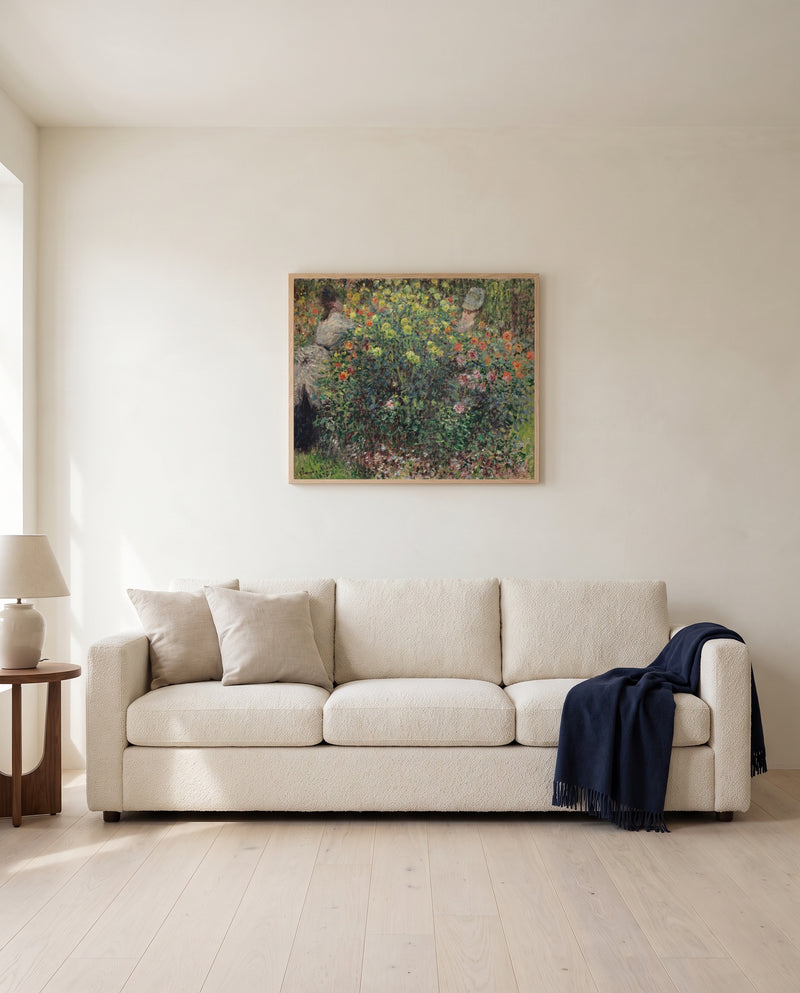 Women among the Flowers by Claude Monet framed in natural oak above a cream sofa in a warm living room