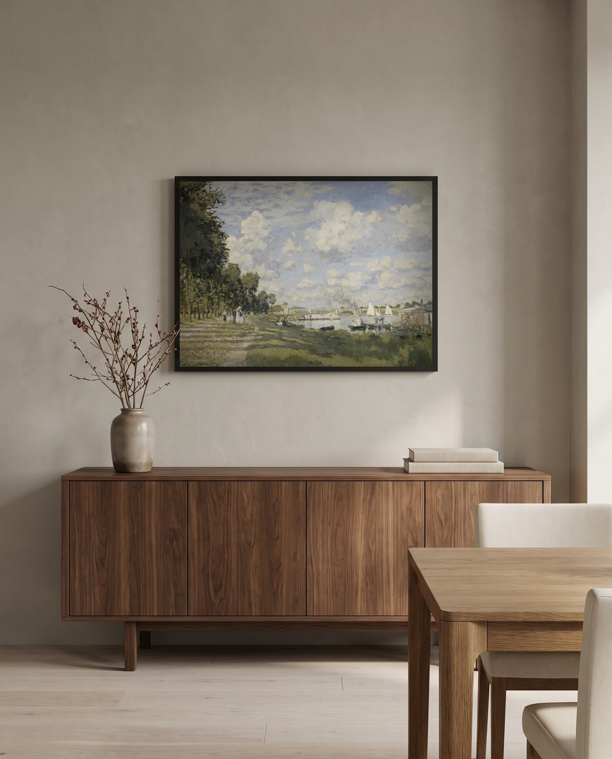 Le Bassin d’Argenteuil by Claude Monet in a black frame above a walnut sideboard in a dining room