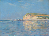 Low Tide at Pourville by Claude Monet: a golden chalk cliff and its reflection over a calm blue sea at low tide