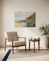 Low Tide at Varengeville by Claude Monet as a stretched canvas above a linen lounge chair in a reading corner