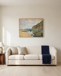 Low Tide at Varengeville by Claude Monet framed in natural oak above a cream sofa in a warm living room