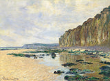 Low Tide at Varengeville by Claude Monet: tide pools on a wide beach below tall green cliffs, a pale cloudy sky