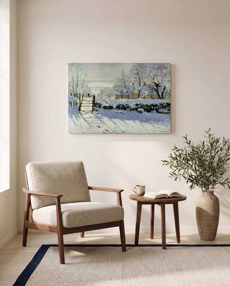 The Magpie by Claude Monet as a stretched canvas above a linen lounge chair in a reading corner