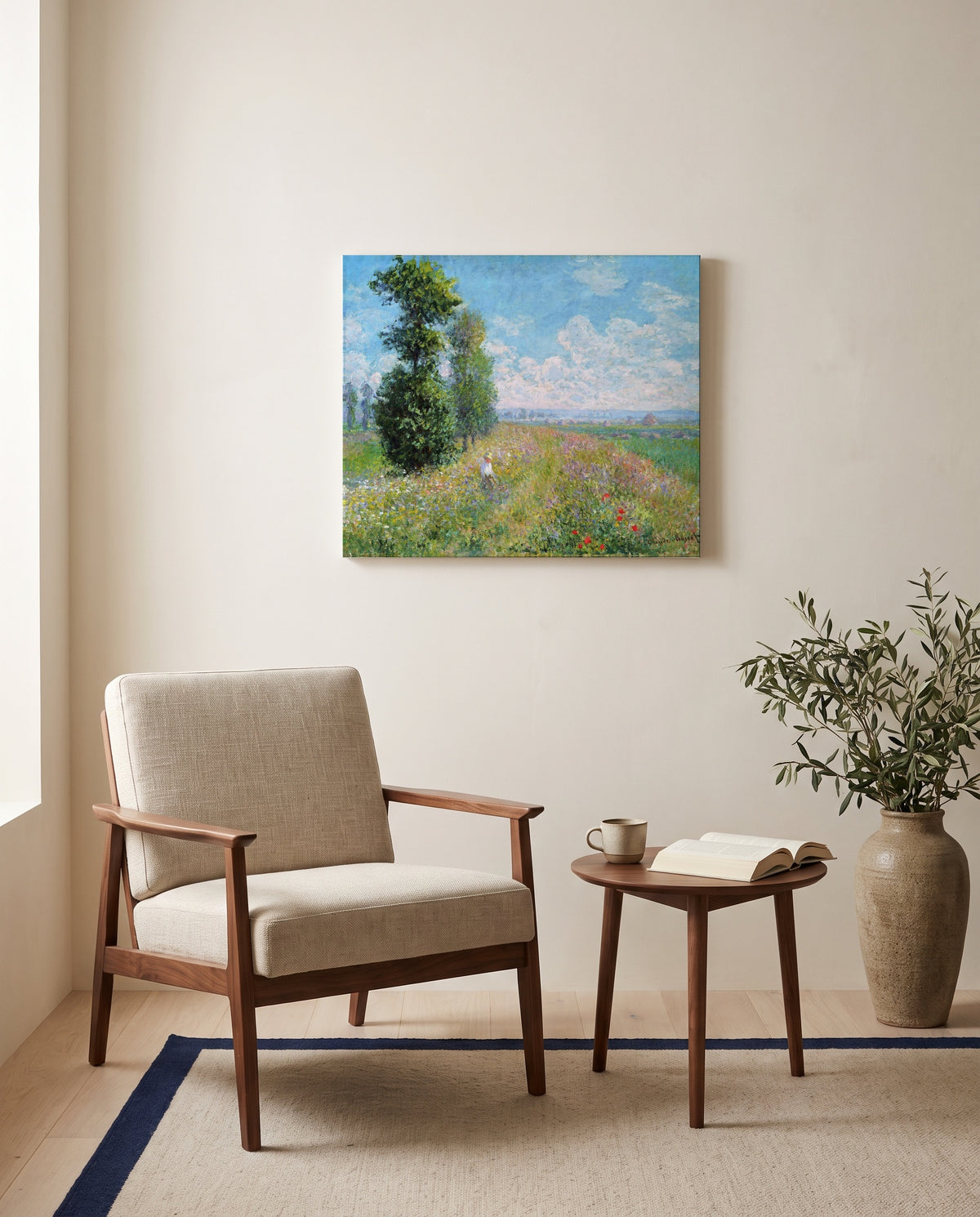Meadow with Poplars by Claude Monet as a stretched canvas above a linen lounge chair in a reading corner