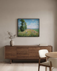 Meadow with Poplars by Claude Monet in a black frame above a walnut sideboard in a dining room