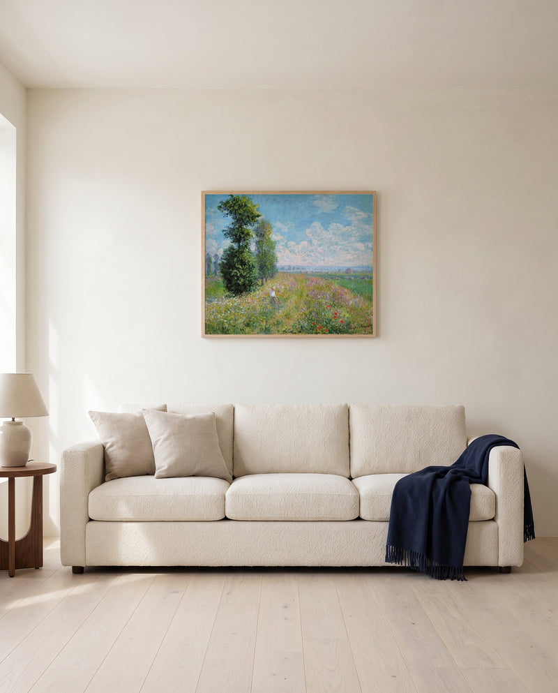 Meadow with Poplars by Claude Monet framed in natural oak above a cream sofa in a warm living room