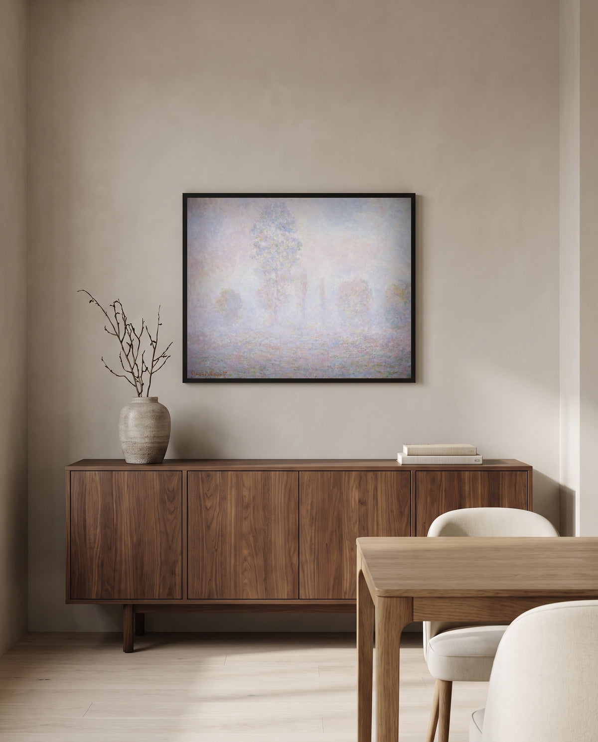 Morning Haze by Claude Monet in a black frame above a walnut sideboard in a dining room