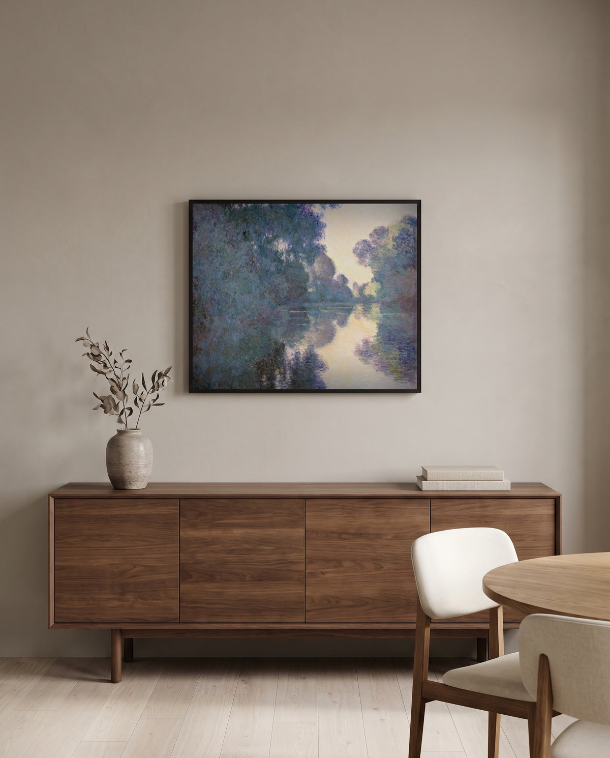 Morning on the Seine by Claude Monet in a black frame above a walnut sideboard in a dining room