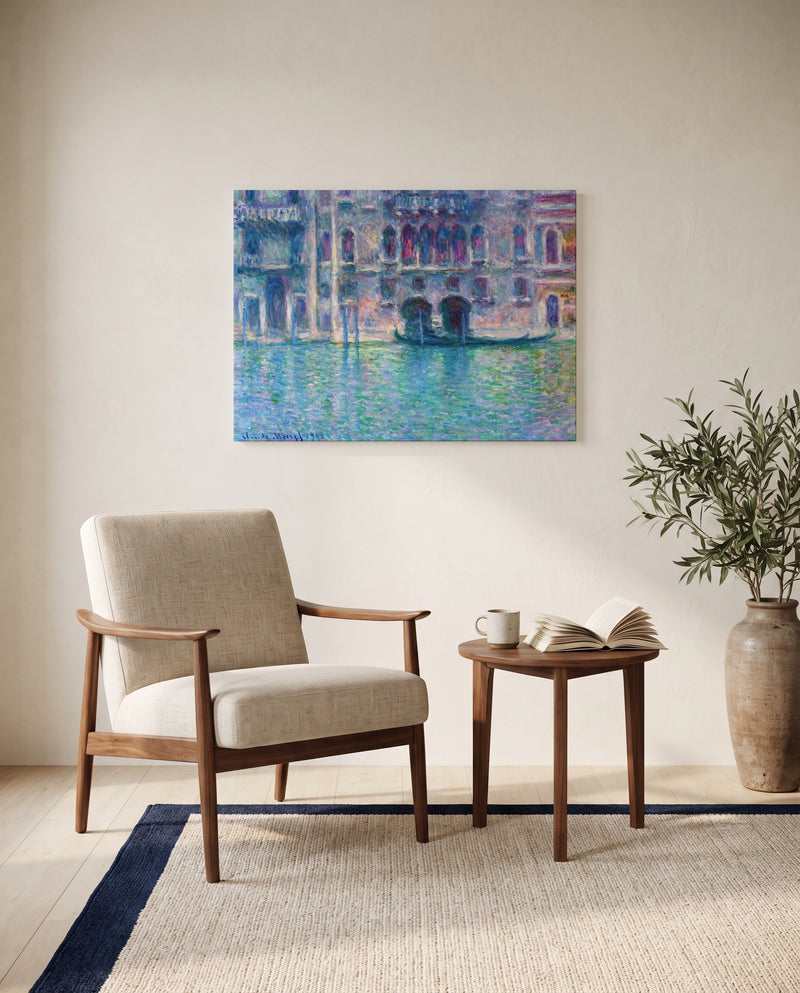 Palazzo da Mula by Claude Monet as a stretched canvas above a linen lounge chair in a reading corner