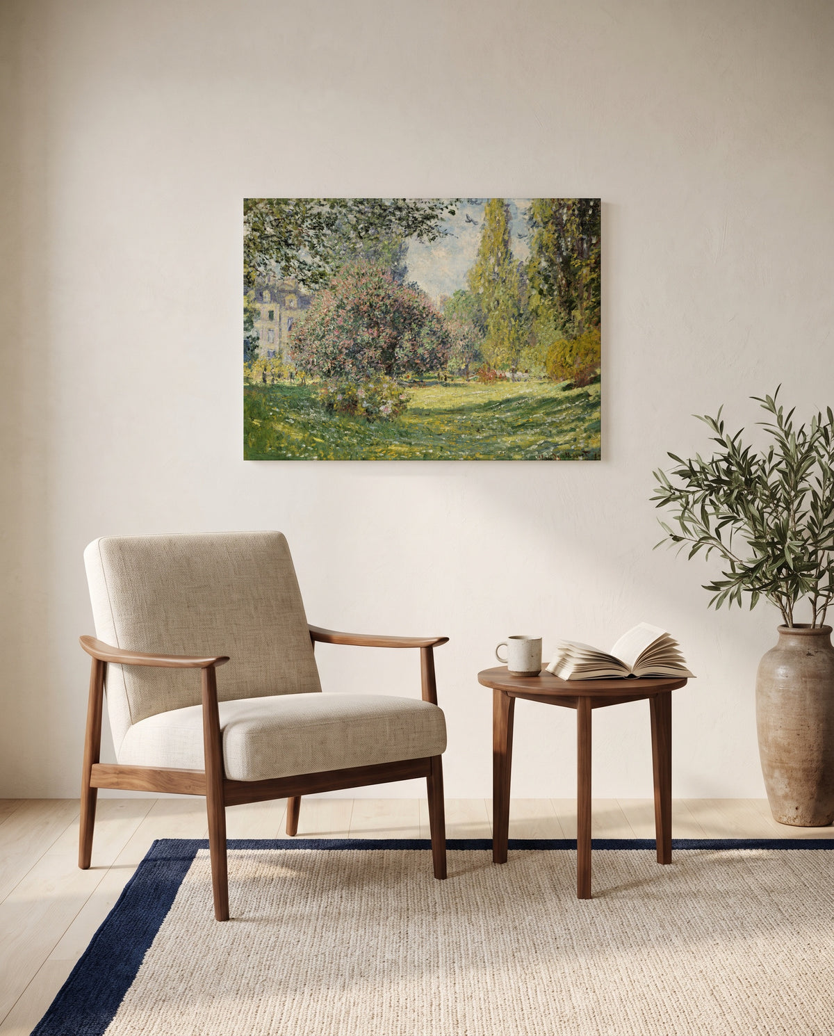 Landscape: The Parc Monceau by Claude Monet as a stretched canvas above a linen lounge chair in a reading corner