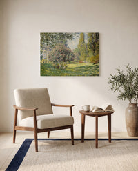 Landscape: The Parc Monceau by Claude Monet as a stretched canvas above a linen lounge chair in a reading corner