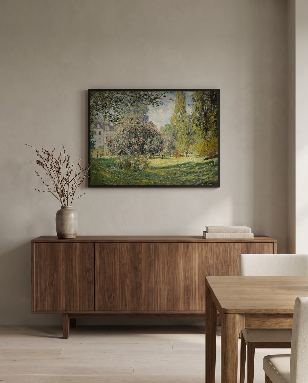 Landscape: The Parc Monceau by Claude Monet in a black frame above a walnut sideboard in a dining room