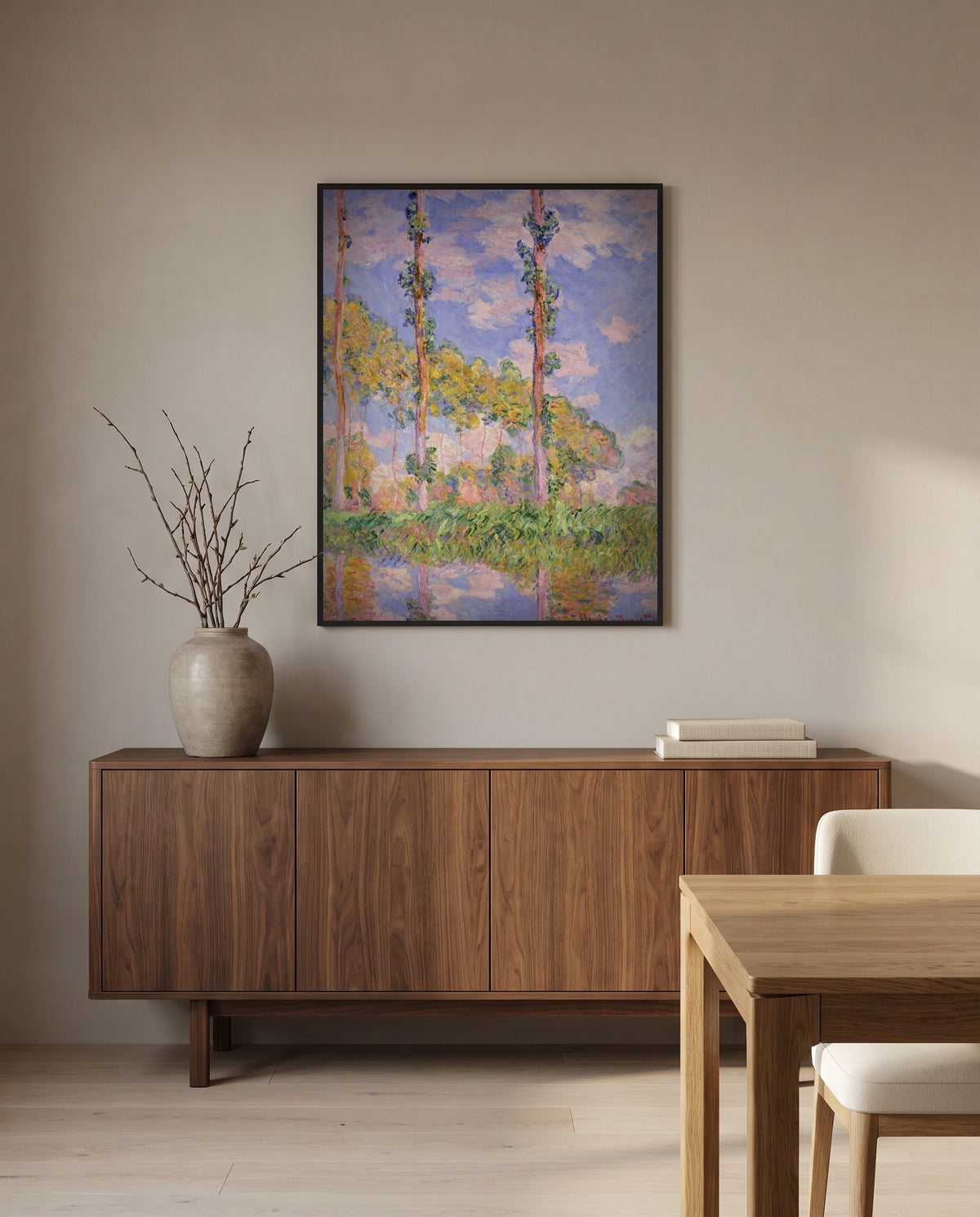Poplars in the Sun by Claude Monet in a black frame above a walnut sideboard in a dining room