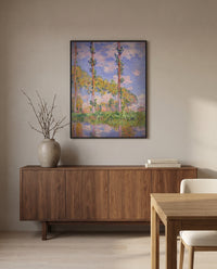 Poplars in the Sun by Claude Monet in a black frame above a walnut sideboard in a dining room