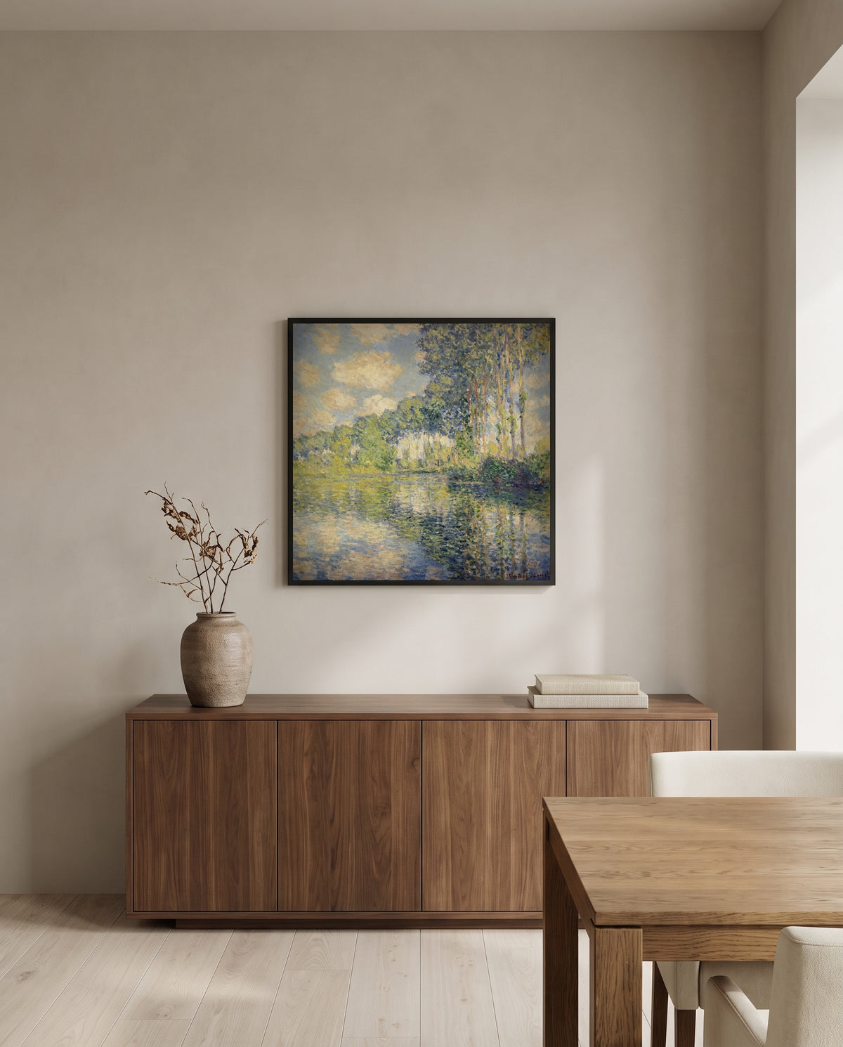 Poplars on the Epte by Claude Monet in a black frame above a walnut sideboard in a dining room