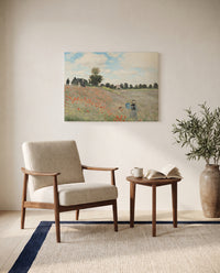 Poppies by Claude Monet as a stretched canvas above a linen lounge chair in a reading corner