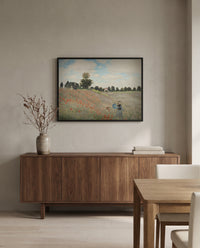 Poppies by Claude Monet in a black frame above a walnut sideboard in a dining room