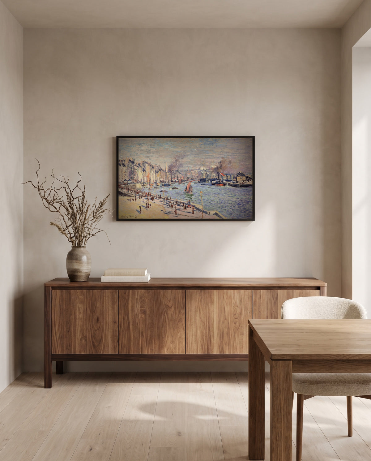 Port of Le Havre by Claude Monet in a black frame above a walnut sideboard in a dining room