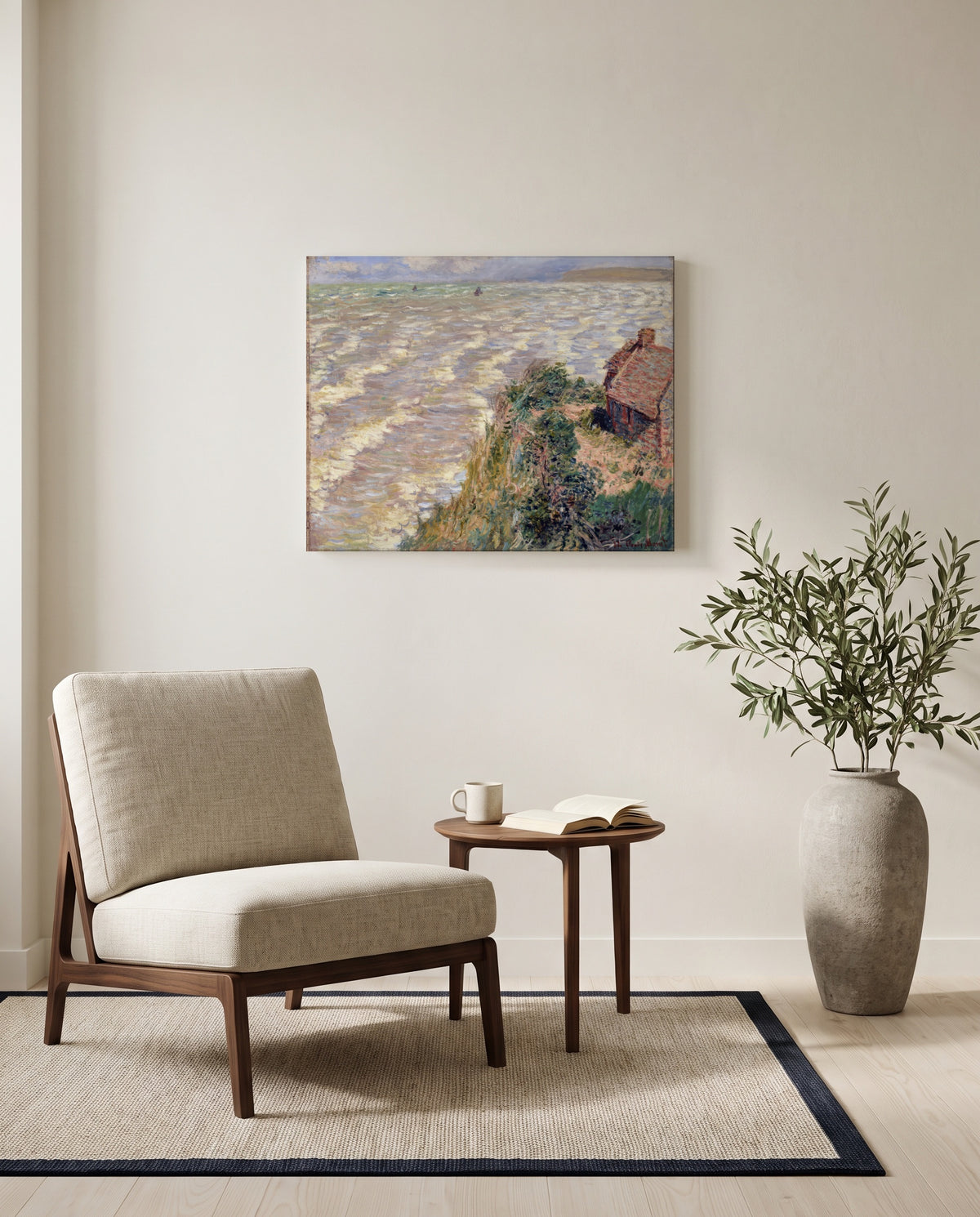 Rising Tide at Pourville by Claude Monet as a stretched canvas above a linen lounge chair in a reading corner