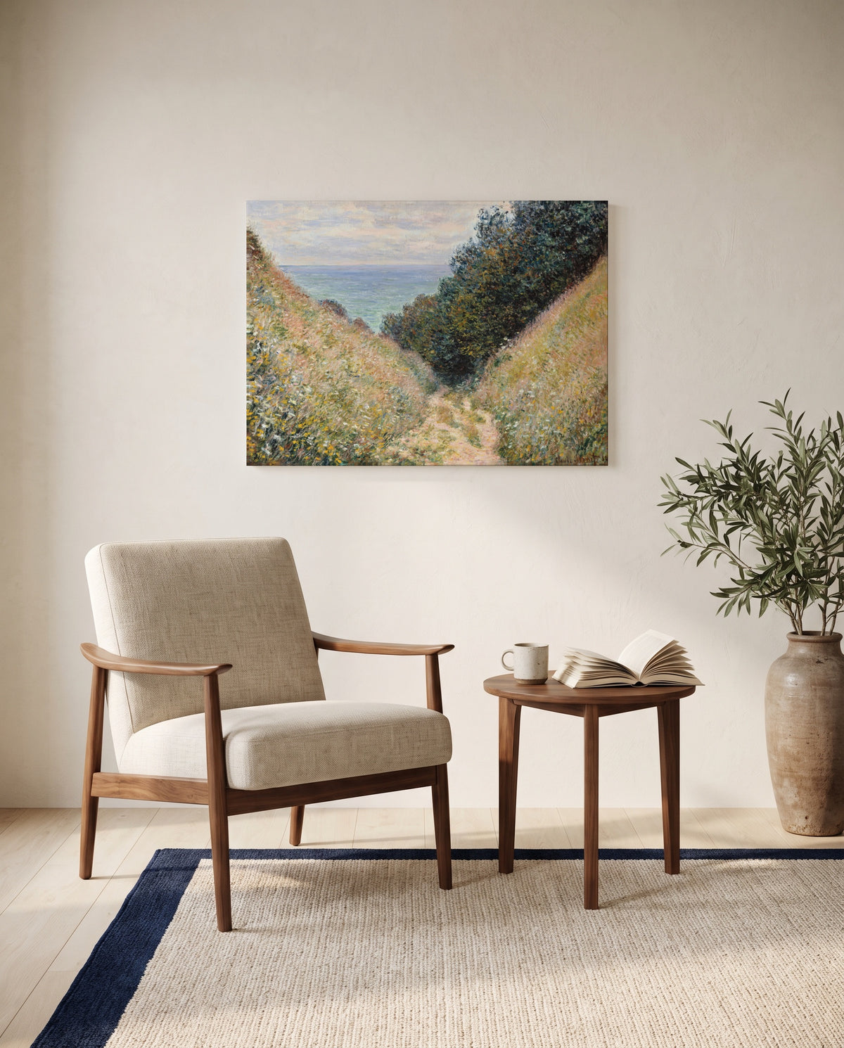 Road at La Cavée by Claude Monet as a stretched canvas above a linen lounge chair in a reading corner