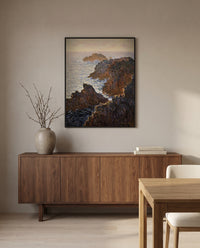 Rocks at Belle-Isle by Claude Monet in a black frame above a walnut sideboard in a dining room